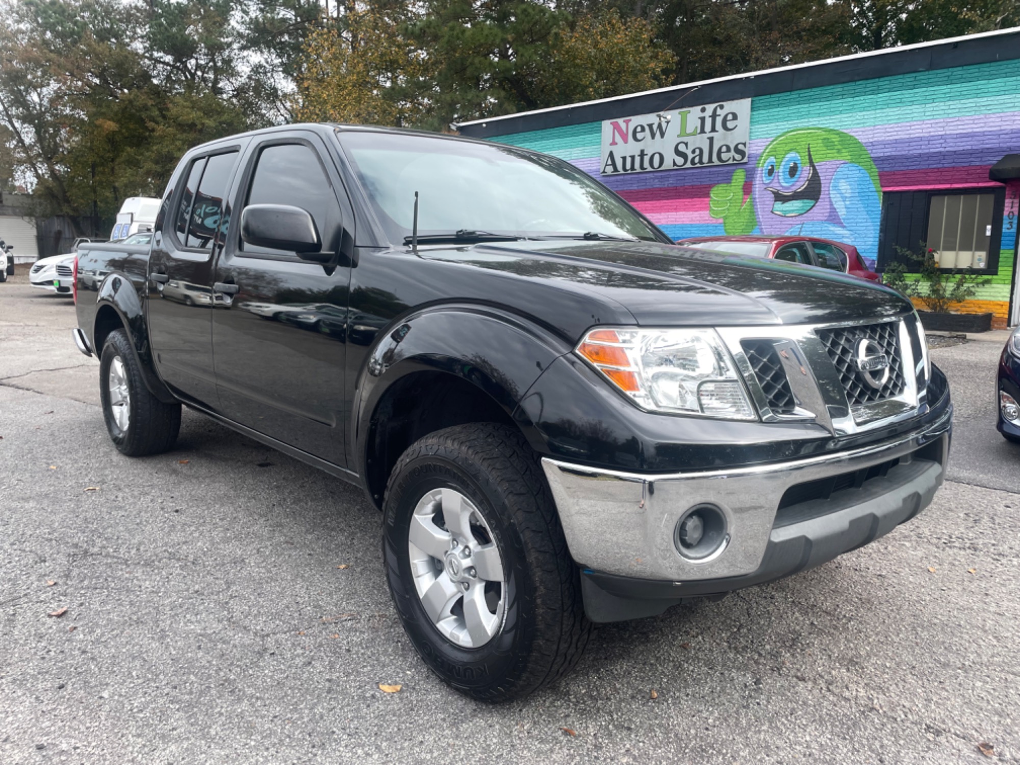 photo of 2009 NISSAN FRONTIER SE CREW CAB - Strong Off-road Ability! Clean CarFax!!